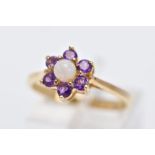 A 9CT GOLD OPAL AND AMETHYST CLUSTER RING, designed with a central opal cabochon (one claw has moved