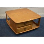 AN ERCOL MODEL 735 BLONDE ELM PANDORA BOX OCCASIONAL TABLE, with two drawers and book storage, on