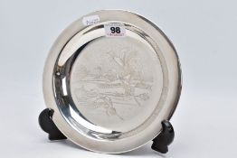 A SILVER DISH, engraved ducks in mid flight scene to the centre of the dish, plain polished rim,