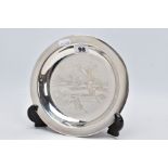 A SILVER DISH, engraved ducks in mid flight scene to the centre of the dish, plain polished rim,