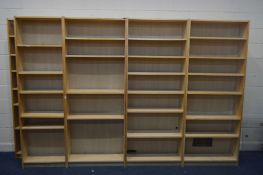 SEVEN MATCHING MODERN BEECH OPEN BOOKCASES, with adjustable shelves, width 80cm x depth 28cm x