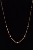 A LATE 20TH CENTURY 9CT GOLD NECKLET, designed with four engraved detailed bars interspaced with