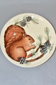 A MOORCROFT POTTERY LIMITED EDITION YEAR PLATE 1995, Squirrel design 132/500, impressed backstamp