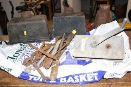 A TRAY CONTAINING CAST IRON GUTTER HOPPERS, a manual winch and a variety of hand tools