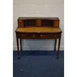 A REPRODUCTION MAHOGANY LADIES DESK, with a tan leather inlay, two frieze drawers, on square