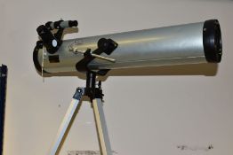 A MODEL 76700 TELESCOPE, diameter 76mm, focal length 700mm, coated lens, mounted on a height