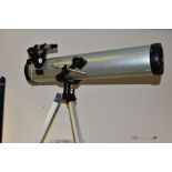 A MODEL 76700 TELESCOPE, diameter 76mm, focal length 700mm, coated lens, mounted on a height