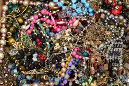 A BOX OF COSTUME JEWELLERY, to include a pair of yellow metal ruby set earrings, variety of bead,