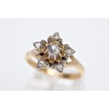 A ROUND DIAMOND FLOWER CLUSTER RING SET WITH ROSE CUT DIAMONDS, estimated diamond weight 0.25ct,