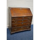 A DISTRESSED GEORGIAN OAK BUREAU, with three long graduated drawers, on bracket feet, width 92cm x