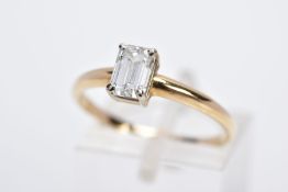 A MODERN SINGLE STONE DIAMOND RING, designed with a claw set emerald cut diamond, total estimated