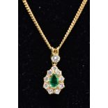 AN EMERALD AND DIAMOND PENDANT NECKLET, the yellow metal tear drop pendant set with a central pear