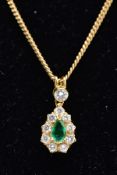 AN EMERALD AND DIAMOND PENDANT NECKLET, the yellow metal tear drop pendant set with a central pear