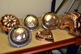 THREE VINTAGE CIRCULAR COPPER STRAINERS, each fitted with a hanging loop and worn plating,