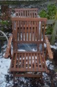 TWO TEAK FOLDING GARDEN ARMCHAIRS, along with four metal framed folding armchairs (6)