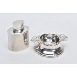 A SILVER TEA STRAINER AND TEA CADDY, the tea strainer with double openwork handles hallmarked