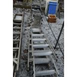 A WERNER ABRU ALUMINIUM STEP LADDER, three other aluminium step ladder, an aluminium loft ladder,