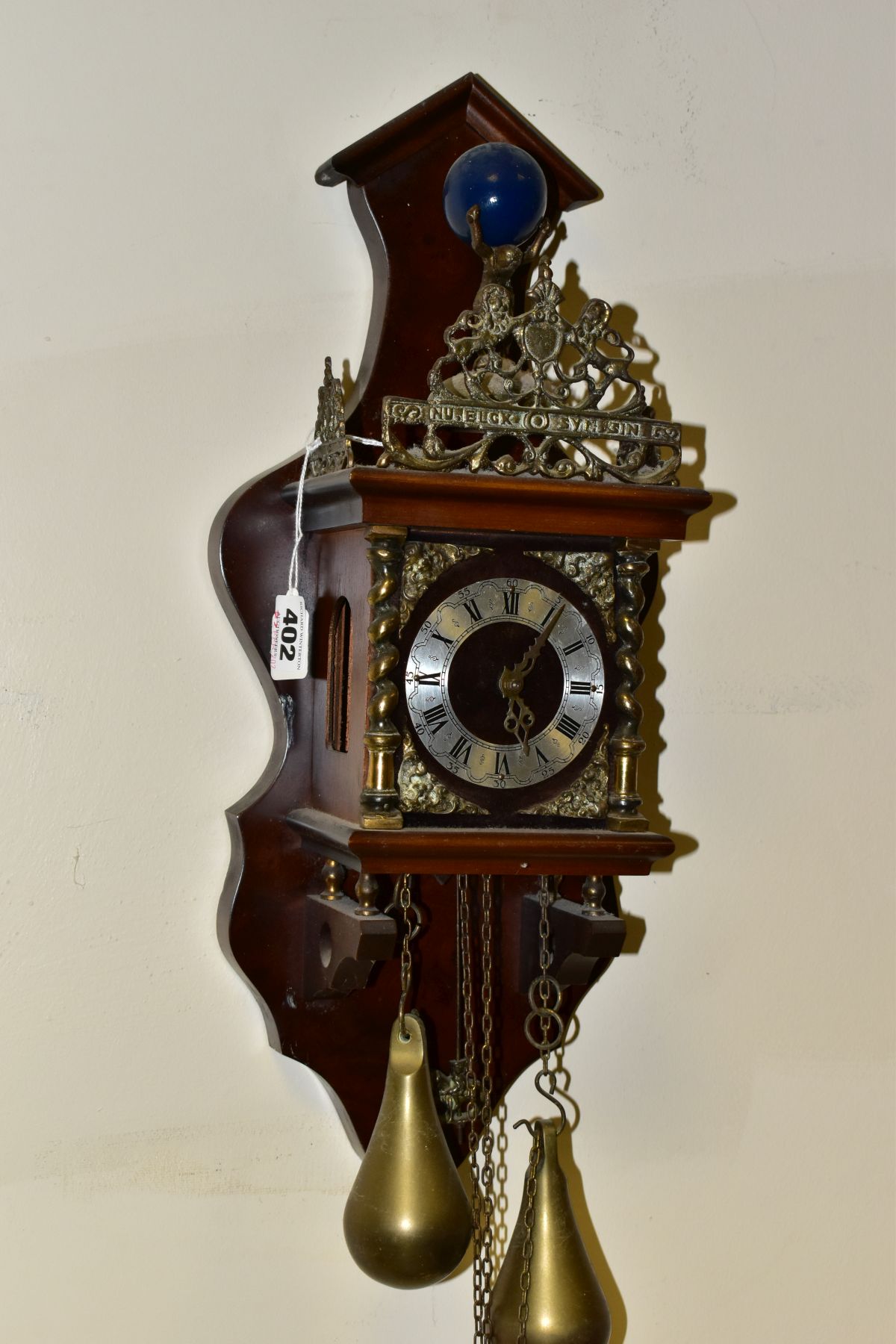A REPRODUCTION DUTCH STYLE WALL CLOCK, with Atlas finial above, pierced gallery and crest, dial with