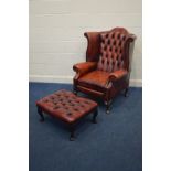 AN OXBLOOD BUTTONBACK ARMCHAIR, 83cm x depth 86cm x height 88cm (one tear to left arm) and a