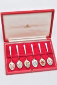 A CASED SET OF SIX SILVER ENAMELLED COFFEE SPOONS, each silver gilt spoon has a decorative floral