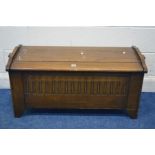 AN OAK BLANKET CHEST, with lunette carved front, width 105cm x depth 44cm x height 49cm