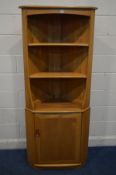 AN ERCOL MODEL 743C BLONDE ELM OPEN CORNER CUPBOARD, above a single cupboard door, width 76cm x