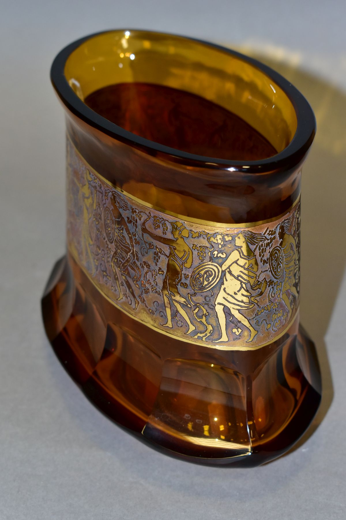 A MOSER OVAL AMBER GLASS VASE, with a gilt band of relief decorated Amazons with spears, shields and - Image 4 of 8