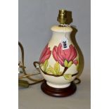 A MOORCROFT 'PINK MAGNOLIA' baluster shaped lamp base fitted to a wooden base, metal bayonet light