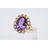 A 9CT GOLD AMETHYST AND PEARL CLUSTER RING, designed with a central oval mix cut amethysts, within a