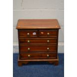 A SMALL HARDWOOD CHEST OF TWO SHORT OVER THREE LONG DRAWERS, brass turned handles, on bracket