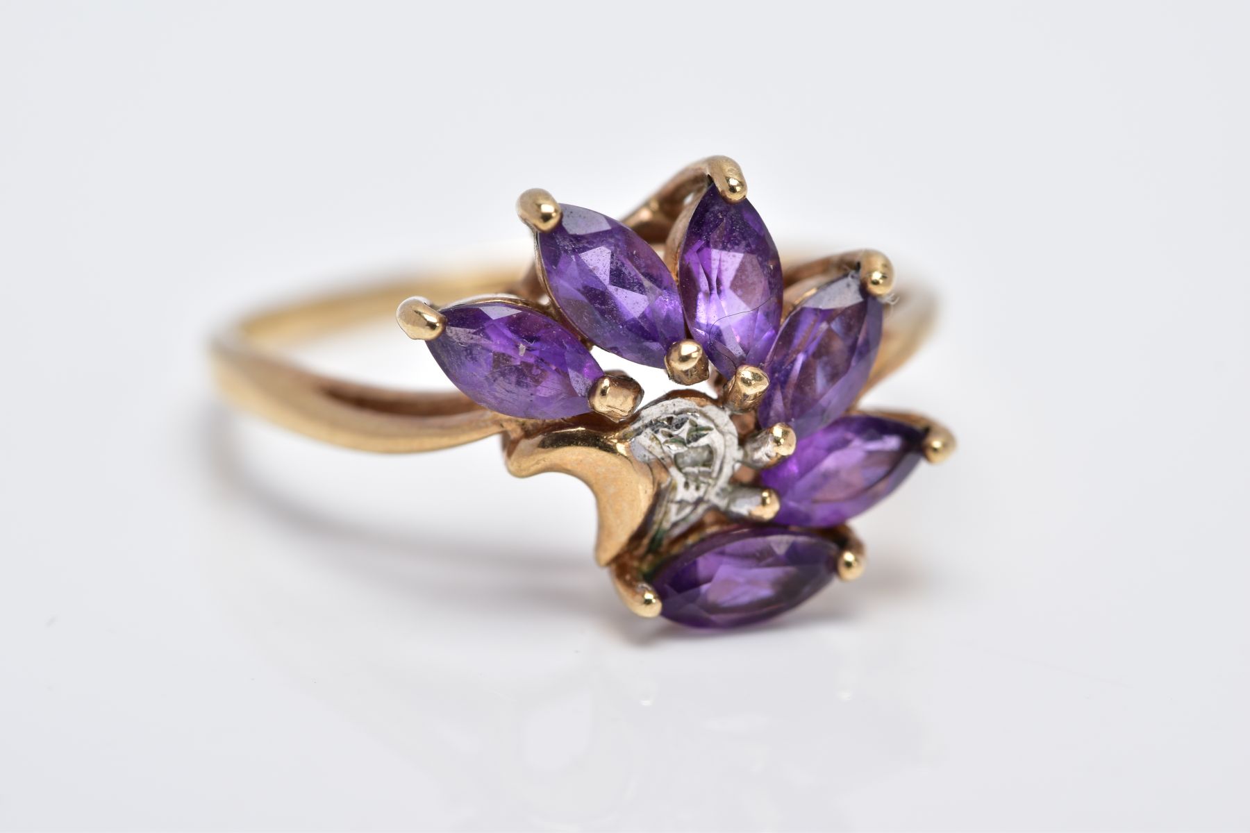 A 9CT GOLD AMETHYST RING, designed as a spray of marquise cut amethyst with a single cut diamond - Image 4 of 4