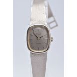 A LADIES 14CT WHITE GOLD TISSOT WRISTWATCH, rounded square silver dial signed 'Tissot Stylist',