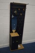 A 1950'S BLACK FINISH HALL STAND, with a brassed coat stand, oval mirror above a single cupboard