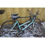 A VINTAGE BLACK RALEIGH GENTS ROAD BIKE, along with an Arizona Emmile ladies bike (2)