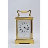 A TAYLOR AND BLIGH CARRIAGE CLOCK, modern battery operated carriage clock with a white dial,