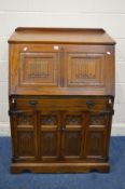 AN OLD CHARM OAK BUREAU/COMPUTER DESK, above double bifold doors, width 84cm x depth 59cm x height