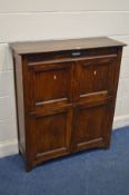 AN EARLY TO MID 20TH CENTURY OAK PANELLED FOUR DOOR CUPBOARD, width 92cm x 33cm x height 107cm