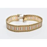 A 9CT TRI-COLOURED GOLD WIDE FLAT LINK BRACELET, designed with textured yellow, rose and white