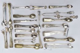 A PAIR OF SILVER SUGAR TONGS AND TWENTY ONE OTHERS, to include a pair of George III bright cut sugar