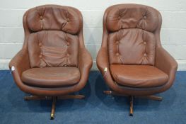 A PAIR OF SCHREIBER BROWN LEATHERETTE SWIVEL ARMCHAIRS (sd)