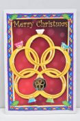 CHRISTMAS COLOURED FIVE GOLDEN RINGS FIFTY PENCE, Isle of Man coin Pobjoy mounted on card in 2009, a