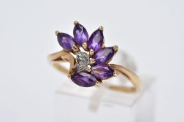 A 9CT GOLD AMETHYST RING, designed as a spray of marquise cut amethyst with a single cut diamond