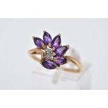 A 9CT GOLD AMETHYST RING, designed as a spray of marquise cut amethyst with a single cut diamond
