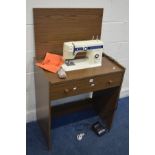 A NEWHOME MODEL 109/110 SEWING MACHINE in a teak finish case (PAT pass and working)