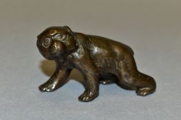 A JAPANESE BRONZE OF A MACAQUE ON ALL FOURS, indistinct character marks to the belly, 112.6 grams,