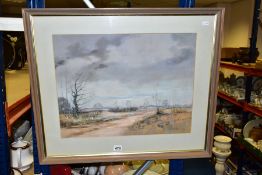 A WINTER LANDSCAPE OF OPEN HEATHLAND WITH DIRT ROAD LEADING TO THE DISTANCE, indistinctly signed