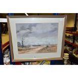 A WINTER LANDSCAPE OF OPEN HEATHLAND WITH DIRT ROAD LEADING TO THE DISTANCE, indistinctly signed