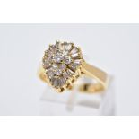 A YELLOW METAL DIAMOND CLUSTER RING, the raised cluster of a pear shape designed with a round