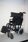 AN AFORDABLE CARE COMPANY FOLDING WHEELCHAIR with footrests