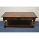 A REPRODUCTION OAK COFFEE TABLE, with two drawers and undershelf, width 122cm x 61cm x height 47cm